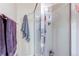 Bright bathroom features a glass shower with chrome fixtures and tiled walls at 11651 E Yale Way, Aurora, CO 80014