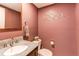 This half bathroom boasts decorative accents, granite countertops and a wall-mounted mirror at 11651 E Yale Way, Aurora, CO 80014