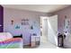 Bright bedroom showcases decor and a spacious layout with easy access to the doorway at 11651 E Yale Way, Aurora, CO 80014