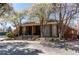 Attractive building featuring brick facade, well-maintained landscaping, and inviting entrance steps at 11651 E Yale Way, Aurora, CO 80014