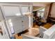 Bright, welcoming two-story foyer with grand double doors, hardwood floors, and an elegant chandelier at 11651 E Yale Way, Aurora, CO 80014