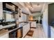 Bright kitchen with white cabinets, tile floors, and modern appliances at 11651 E Yale Way, Aurora, CO 80014