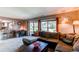 Comfortable living room with large sectional and sliding glass door access to outdoor space at 11651 E Yale Way, Aurora, CO 80014