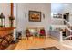 Bright living room with hardwood floors, two-story ceilings, brick fireplace and an open concept staircase at 11651 E Yale Way, Aurora, CO 80014