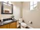 Well-lit powder room with pedestal sink, modern fixtures, and fresh ambiance at 1410 S Elizabeth St, Denver, CO 80210