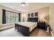 Cozy bedroom featuring a large window with window seat and dark wood furniture at 1410 S Elizabeth St, Denver, CO 80210