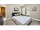 Bedroom features neutral walls, a large window, and comfortable furnishings at 1410 S Elizabeth St, Denver, CO 80210