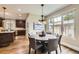 Cozy dining area with large windows providing natural light and backyard views at 1410 S Elizabeth St, Denver, CO 80210