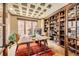 Well-appointed home office with custom built-ins, a coffered ceiling, and ample desk space at 1410 S Elizabeth St, Denver, CO 80210