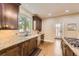 Spacious kitchen featuring custom cabinetry, granite counters and stainless steel appliances at 1410 S Elizabeth St, Denver, CO 80210
