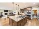 Well-equipped kitchen features a center island with granite countertops and stainless steel appliances at 1410 S Elizabeth St, Denver, CO 80210