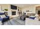 Comfortable living room has a fireplace, built-in shelves, and plush seating at 1410 S Elizabeth St, Denver, CO 80210