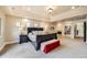 Inviting main bedroom boasts a fireplace, and ample natural light from the windows at 1410 S Elizabeth St, Denver, CO 80210