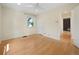 Large bedroom with hardwood floors, natural light, and a ceiling fan at 1111 Kearney St, Denver, CO 80220