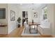 Charming dining room featuring a built-in bench, wood table, and modern lighting at 1111 Kearney St, Denver, CO 80220