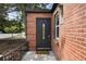 Close up of front entry featuring an ornate door with glass insert and a welcoming front porch at 1111 Kearney St, Denver, CO 80220