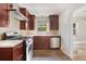 Cozy kitchen with stainless appliances, stone tile floor and ample counter space at 1111 Kearney St, Denver, CO 80220