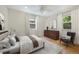 Inviting bedroom with a comfortable bed, dresser, and ample natural light at 1111 Kearney St, Denver, CO 80220