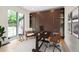Bright home office featuring a Murphy bed, built-in shelves, desk, and lots of natural light at 1111 Kearney St, Denver, CO 80220