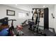 Spacious basement area with workout equipment and rubber floors at 8571 S Estes St, Littleton, CO 80128
