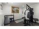 Home basement gym with exercise equipment at 8571 S Estes St, Littleton, CO 80128