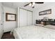 Well-lit bedroom with a ceiling fan and a storage closet at 8571 S Estes St, Littleton, CO 80128