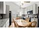 Bright and airy eat-in kitchen with granite countertops, modern appliances, and stylish cabinetry, ideal for casual dining at 8571 S Estes St, Littleton, CO 80128