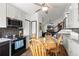Kitchen boasts modern appliances, granite countertops, and an open layout, perfect for cooking and gatherings at 8571 S Estes St, Littleton, CO 80128