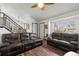 Living room with hardwood floors, and a large window letting in natural light, creating a comfortable area at 8571 S Estes St, Littleton, CO 80128