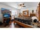 Comfortable main bedroom with dark wood-look floors and a desk in the corner at 8571 S Estes St, Littleton, CO 80128
