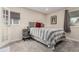 Comfortable bedroom featuring a plush bed, soft lighting, and neutral decor at 8335 Fairmount Dr # 10-208, Denver, CO 80247