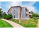 Charming two-story condo with stone accents and well-maintained landscaping at 8335 Fairmount Dr # 10-208, Denver, CO 80247