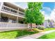 Attractive two-story condo featuring a balcony and lush greenery at 8335 Fairmount Dr # 10-208, Denver, CO 80247
