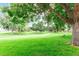 Spacious green space featuring mature trees and shaded seating areas for the community at 8335 Fairmount Dr # 10-208, Denver, CO 80247