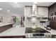 Modern kitchen with stainless steel appliances and view to living area at 8335 Fairmount Dr # 10-208, Denver, CO 80247