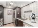 Stainless steel fridge, white subway tile and counterspace in updated kitchen at 8335 Fairmount Dr # 10-208, Denver, CO 80247