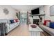 Well-lit living room boasts a fireplace, sleek furniture, and an inviting ambiance at 8335 Fairmount Dr # 10-208, Denver, CO 80247