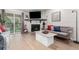 Inviting living room with a fireplace, modern decor, and access to the outdoor patio at 8335 Fairmount Dr # 10-208, Denver, CO 80247
