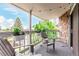 Inviting outdoor patio with cozy seating, hanging plants and picturesque views at 8335 Fairmount Dr # 10-208, Denver, CO 80247