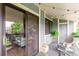 Outdoor patio with sliding glass door and comfortable seating area at 8335 Fairmount Dr # 10-208, Denver, CO 80247