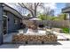 The home has a modern backyard patio with outdoor dining and ample space for entertaining and enjoying the outdoors at 1321 S Edison Way, Denver, CO 80222