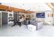 This home has a converted garage with comfortable seating, a large-screen TV, and custom storage for unique living at 1321 S Edison Way, Denver, CO 80222