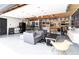The renovated garage offers additional living space with a lounge area, custom storage, and a sleek epoxy floor at 1321 S Edison Way, Denver, CO 80222
