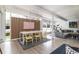 Bright dining area with large windows, a modern table, and seating for six, great for entertaining at 1321 S Edison Way, Denver, CO 80222