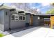 Attractive home exterior with a covered parking, sleek lighting, and tasteful landscaping at 1321 S Edison Way, Denver, CO 80222