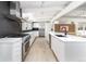 Bright, modern kitchen with white cabinets, stainless steel appliances, and sleek countertops at 1321 S Edison Way, Denver, CO 80222