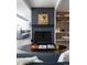 Modern living room with a gray fireplace, eye-catching art, and an open floor plan at 1321 S Edison Way, Denver, CO 80222