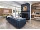 Bright living room with a cozy fireplace, modern decor, and an open layout into the dining area at 1321 S Edison Way, Denver, CO 80222
