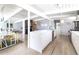 Open living space with a dining area that seamlessly blends with modern kitchen design and layout at 1321 S Edison Way, Denver, CO 80222