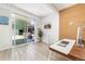 Home office with cork accent wall, glass sliding doors to patio, and hardwood floors at 1321 S Edison Way, Denver, CO 80222